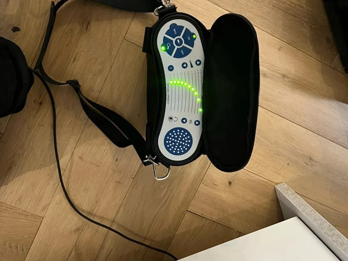 Acoustic leak detection unit in its case on a wooden floor